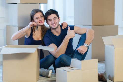 Removal team preparing a Brent home move with boxes and furniture