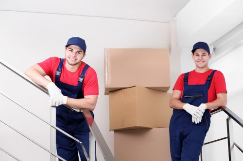 Professional movers organizing boxes during a Brent relocation