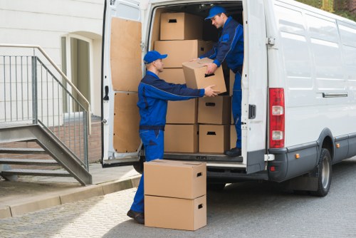 Bulky furniture being loaded for disposal in Brent
