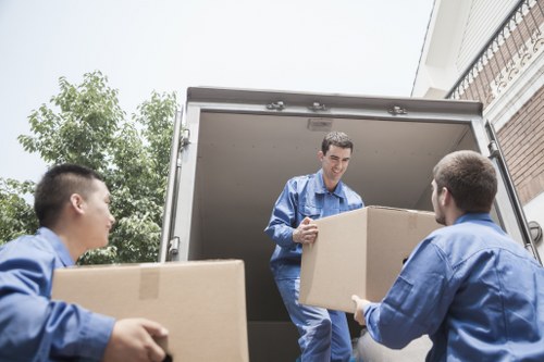 Organised home moving boxes ready for transport in Brent