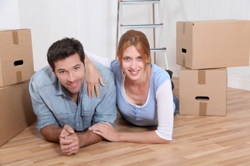 Furniture and packed boxes ready for a Brent move in an urban home