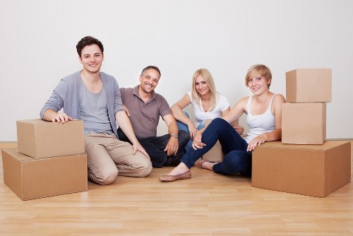 Staff handling packed boxes carefully during a removal job