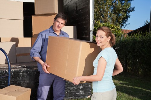 Careful loading of sofa and table for furniture removals in Brent